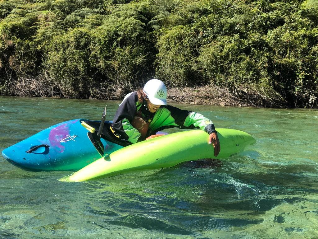 Kayaker on a clear New Zealand river