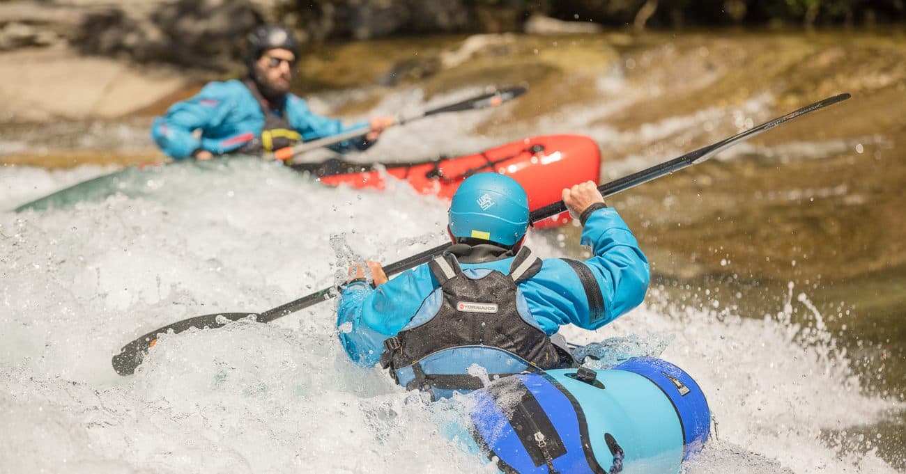 Packrafting through a forested river gorge in New Zealand